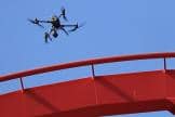 A drone performs an inspection of roller coaster track at Carowinds amusement park